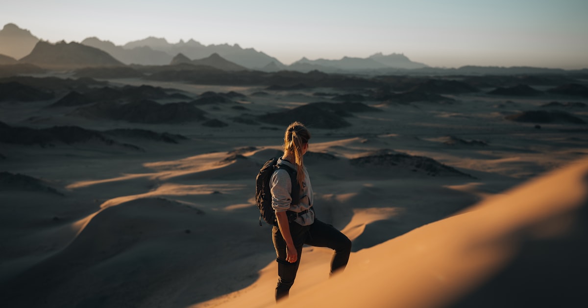 Smartphone with shopping list next to fresh groceries on a kitchen table