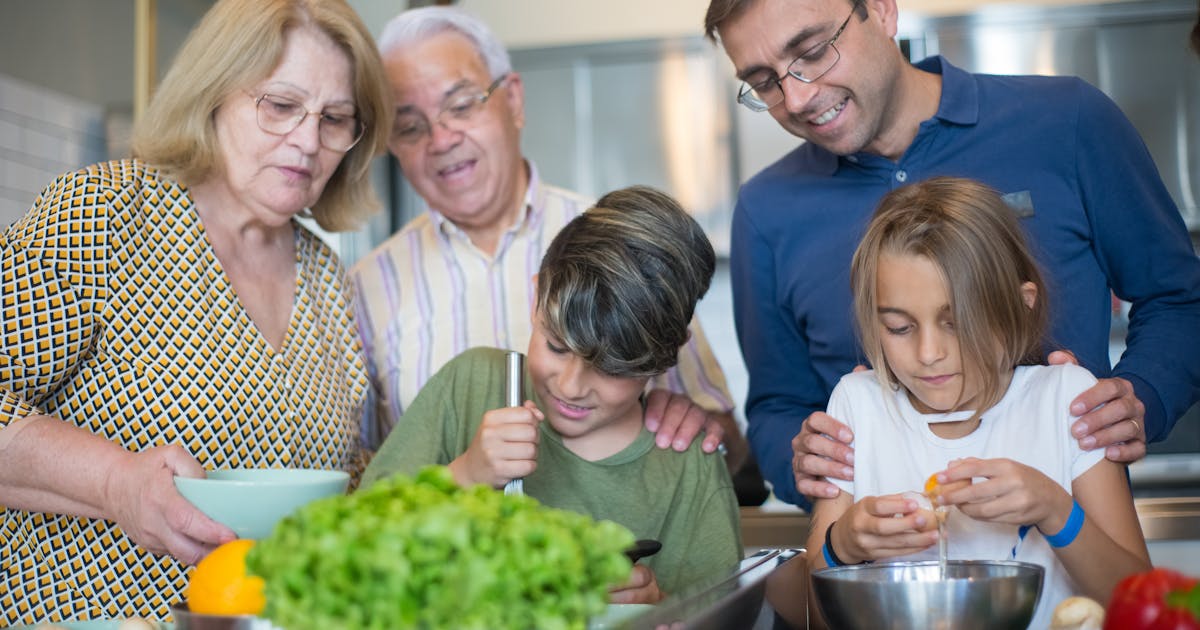 Family cooking together in a Swiss kitchen